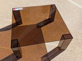a glass table that is sitting on the ground