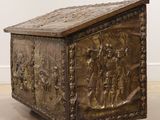 an old wooden chest with carvings on it in a room