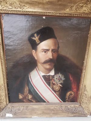 portrait d'un homme en uniforme militaire dans un cadre doré