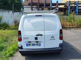a white van that is parked on the side of the road