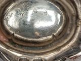 a close up of a silver object on a table