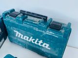a couple of makita tools sitting on top of a table