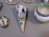 many different pieces of pottery on the table