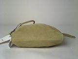 beige pouch with a tag on it sitting on a white surface