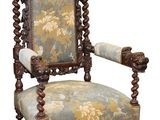 une image d'une chaise avec un dossier et des accoudoirs tapissés de fleurs
