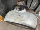 a close up of a rusted metal object on the ground