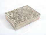 a silver box that is sitting on a white surface