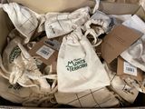 a cardboard box filled with many bags of items