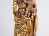 statue of a woman holding a child in her arms