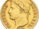 Gros plan sur une pièce d'or ornée d'une tête de femme