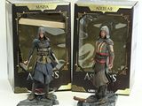 two action figures of a man with a sword and a woman with a sword
