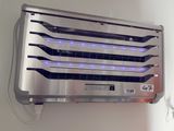 an image of a wall mounted air conditioner with blue lights