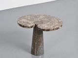 an image of a small table with a stone top on a grey floor
