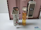 a small bottle of perfume next to a lighter