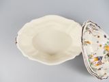 a white bowl with a floral design on it