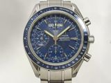 a close up of a watch with a blue dial