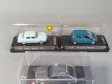 two toy cars that are in a clear box