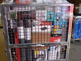 a metal cart with many items in it in a warehouse