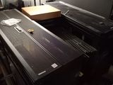 a black piano sitting in a room next to a window
