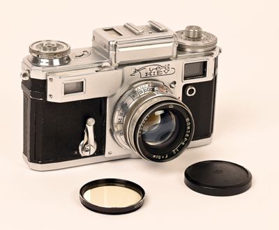 a camera with a lens attached to it and a lens cap