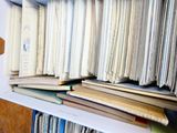 a lot of books on a shelf in a room