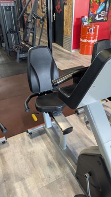 an image of a gym room with a tread machine and other equipment