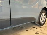 a close up of a car ' s tire on the side of the road