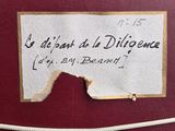 a piece of paper on the back of a red suitcase
