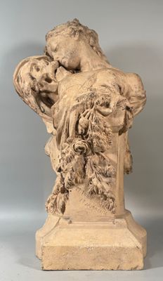 statue of a woman holding a child in her arms