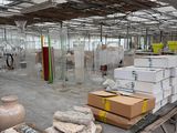 many boxes and boxes on a table in a warehouse