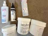 many different types of hair products sitting on the floor