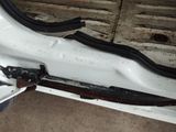 a close up of the front bumper of a white truck