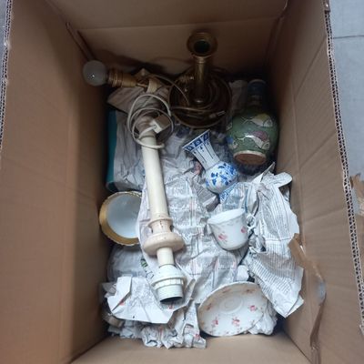 a cardboard box with a bunch of items inside of it
