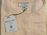 an image of a white shirt with a tag on it