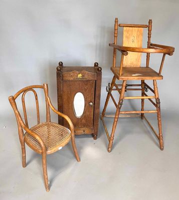 three wooden chairs and a wooden cabinet in a room