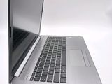 a close up of a laptop computer on a white surface