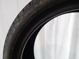 a close up of a tire tire on a white surface