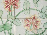 a picture of a picture of flowers on a tile wall