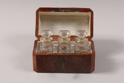 a small wooden box with a set of glasses inside of it