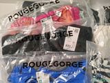 several pairs of underwear are wrapped in plastic bags on a table