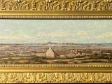 une peinture à l'huile représentant une vue de ville, dans un cadre doré