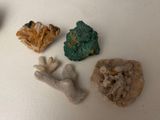 five different types of rocks on a white surface