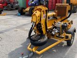 a small machine that is sitting in the parking lot
