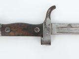 a knife that is laying on a white surface