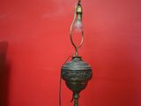 a lamp that is on a stand in a room