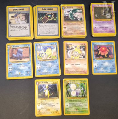 the pokemon cards are all lined up on the table