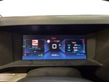 the dashboard of a car with a digital display in the center