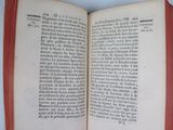 an open book with a red border on it