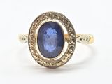 l'image d'une bague en or contenant une pierre bleue