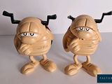 two toy figurines of a man and a woman